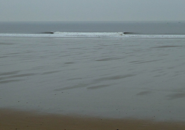 This surf was not a storm day, its to illustrate the huge tides we have here of up to 40ft, this picture is 2 hours before low, and at high the waves will be up where you see the dry sand in the foreground.