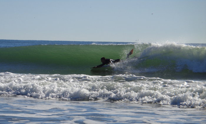 3/2, booties, and gloves. Sun was shining and wind was offshore.